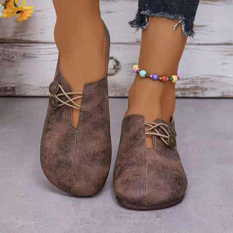Damen Komfortable und stilvolle Slipper mit dekorativen Schnürdetails